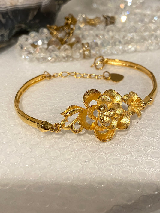 Elegant Floral Gold Tone Bracelet with Extension Chain.